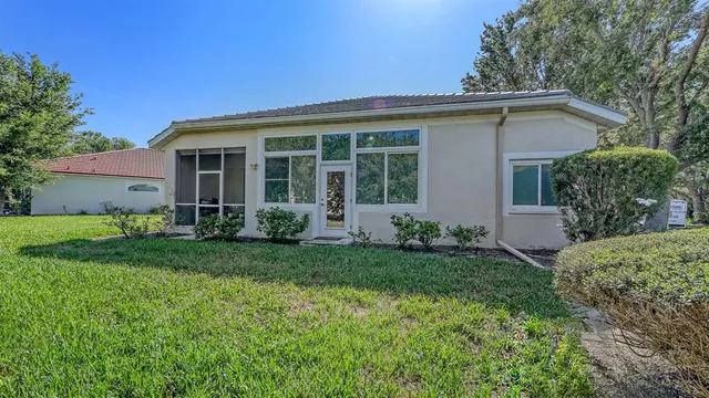 a view of a lake from balcony with outdoor seating