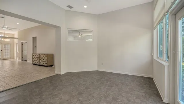 an empty room with a kitchen