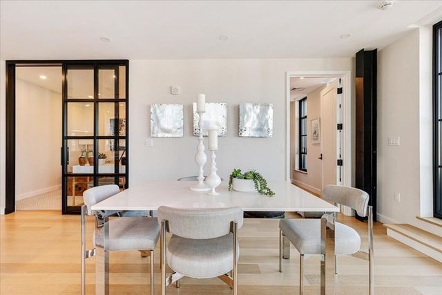 a view of a dining room with furniture and window