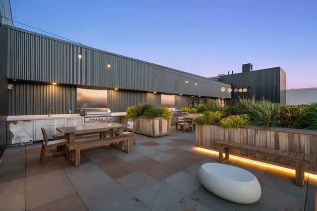 a view of a balcony with furniture