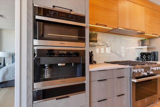 a kitchen with a stove and a microwave