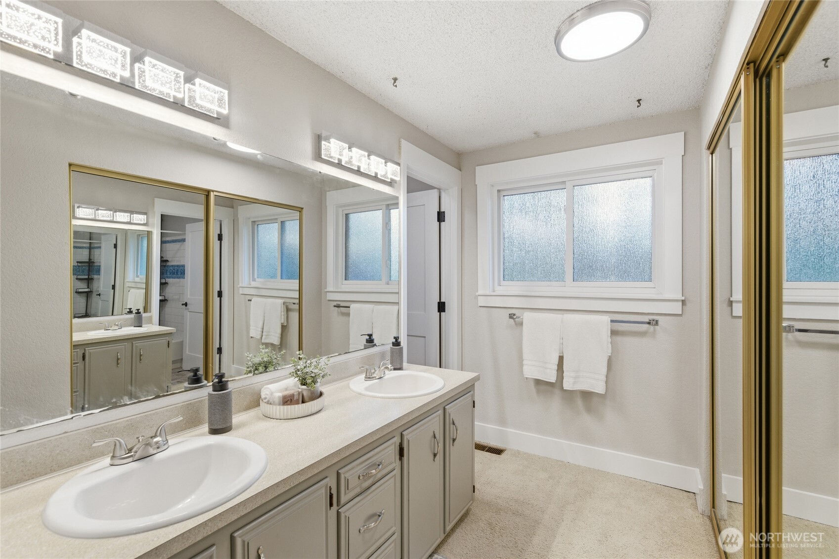 13011 Seattle Hill Road Snohomish, WA 98296 - Photo 16 of 40 a bathroom with a sink double vanity and a mirror