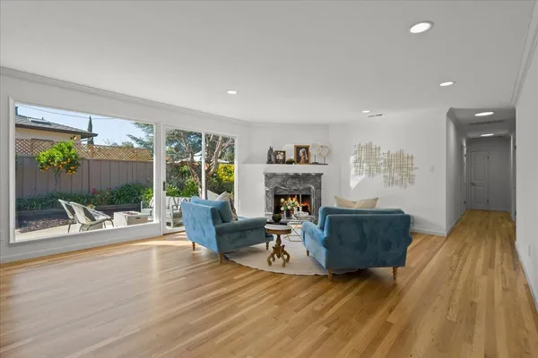a view of a dining room with furniture and wooden floor