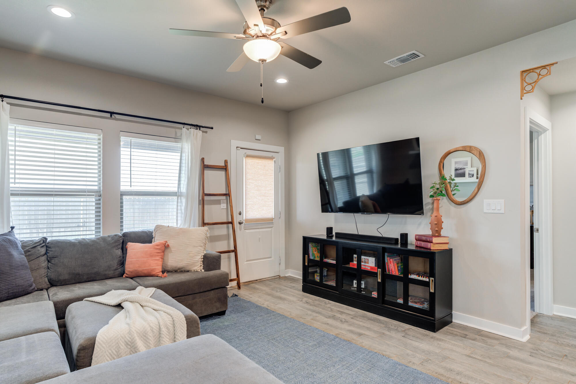 4613 126th Street Lubbock, TX 79424 - Photo 9 of 37 a living room with furniture and a flat screen tv
