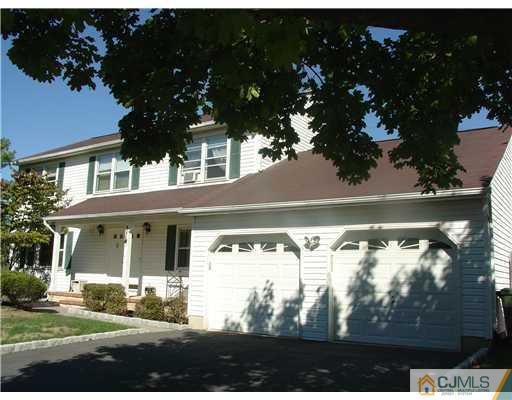 17 Sinclair Road Edison, NJ 08820 - Photo 1 of 11 a front view of a house with a yard