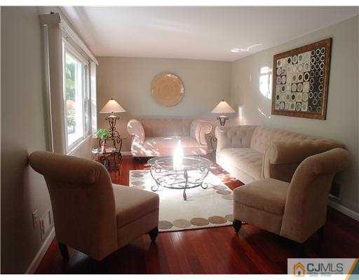 17 Sinclair Road Edison, NJ 08820 - Photo 2 of 11 a living room with furniture and a large window
