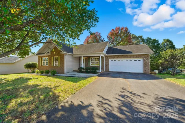 a front view of a house with yard