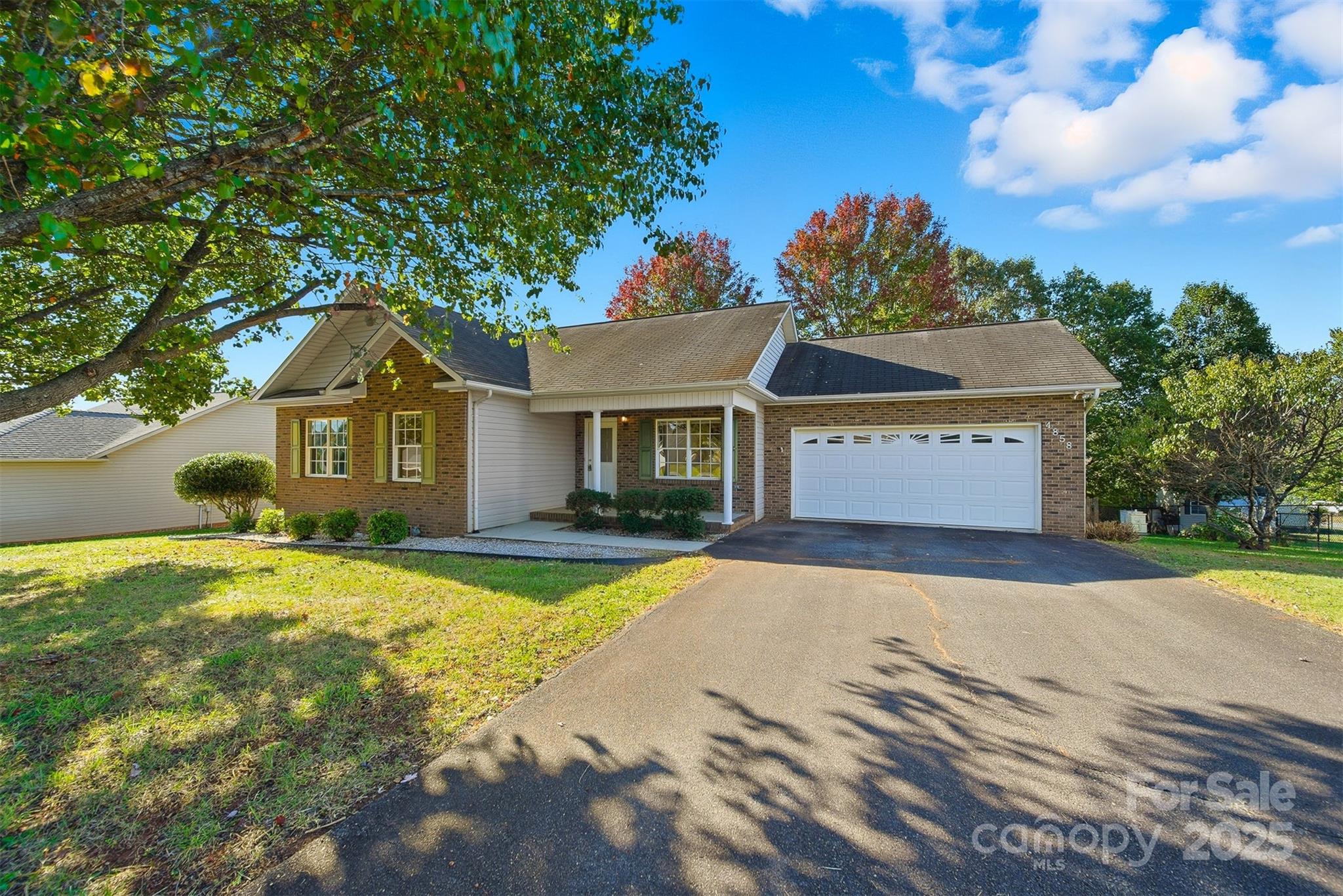a front view of a house with yard