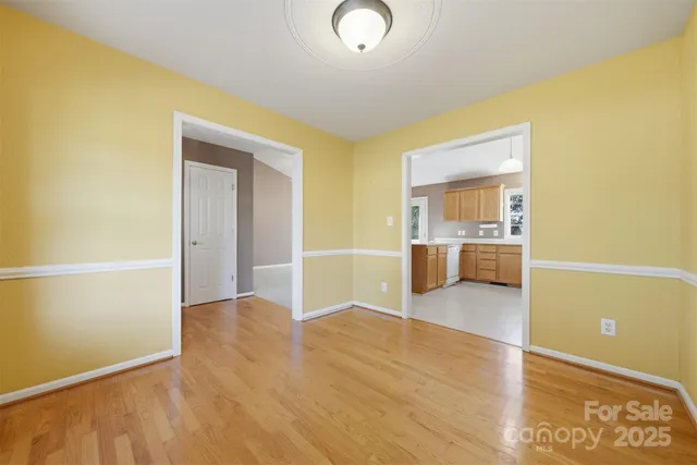 a view of a kitchen cabinets and wooden floor