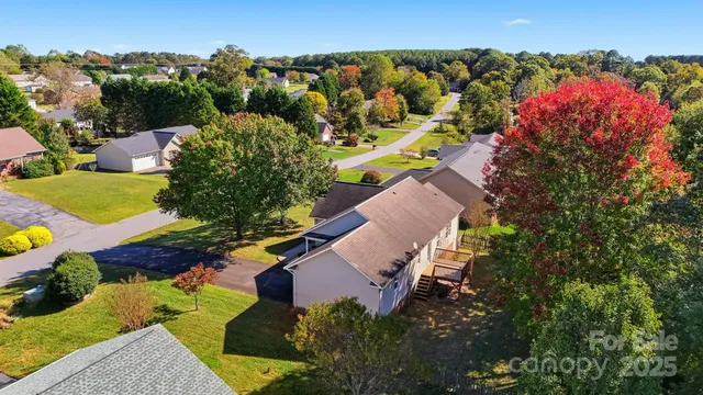 an aerial view of a house with a garden