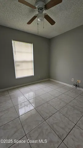 a view of an empty room and a window