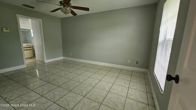 a bathroom with a bathtub and a window