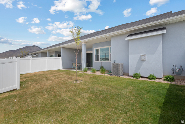 531 North Legend Way West, Unit D Mapleton, UT 84664 - Photo 26 of 42 Back of property with stucco siding and a patio area