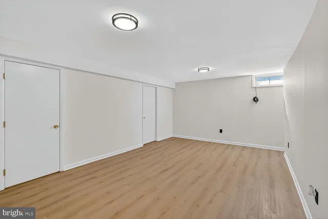 a view of room with wooden floor