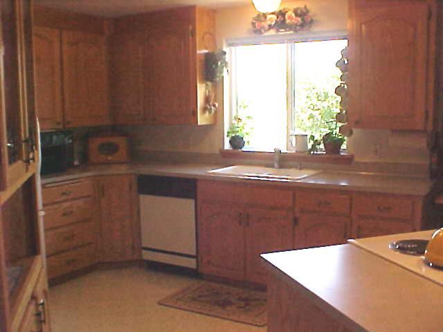 491 East Duffield Road Moxee, WA 98936 - Photo 2 of 9 a kitchen with a sink and a window