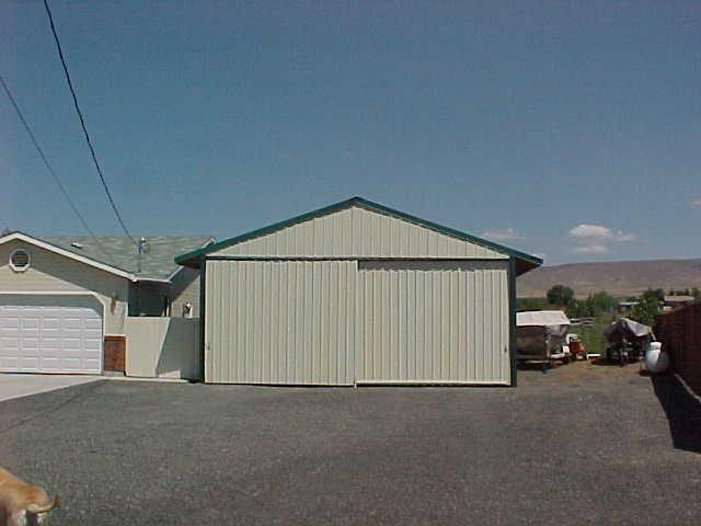 491 East Duffield Road Moxee, WA 98936 - Photo 6 of 9 a view of garage and car parked in garage