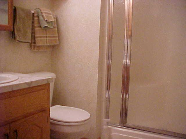 491 East Duffield Road Moxee, WA 98936 - Photo 9 of 9 a bathroom with a toilet and a shower