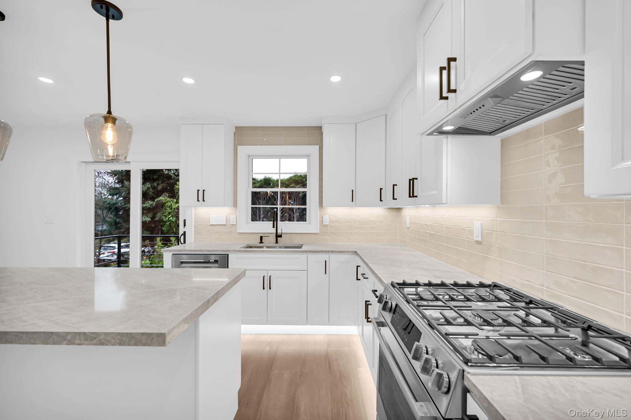 82 Seton Drive New Rochelle, NY 10804 - Photo 16 of 50 a kitchen with granite countertop a sink stove and cabinets