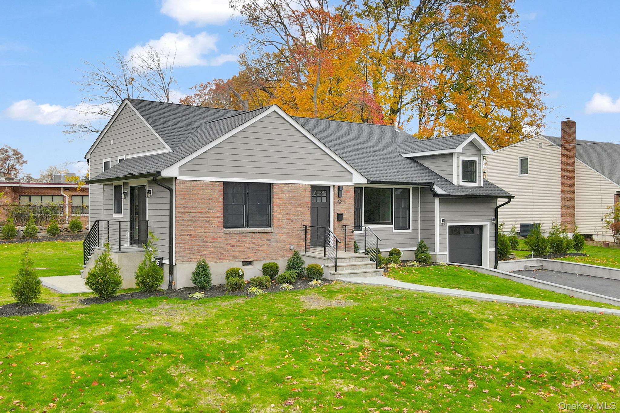 82 Seton Drive New Rochelle, NY 10804 - Photo 2 of 50 a front view of a house with garden and porch