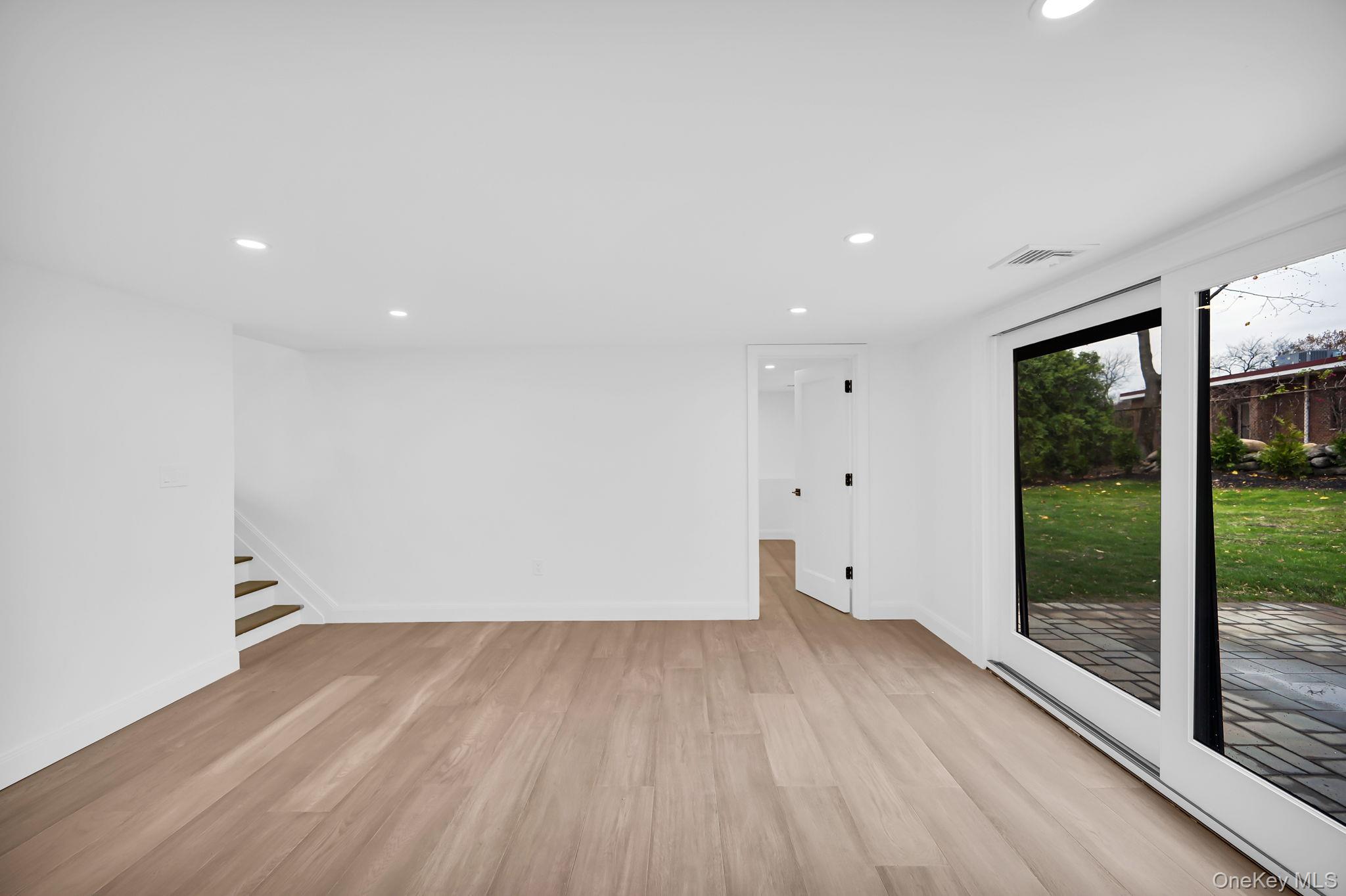 82 Seton Drive New Rochelle, NY 10804 - Photo 37 of 50 a view of empty room with wooden floor and fan