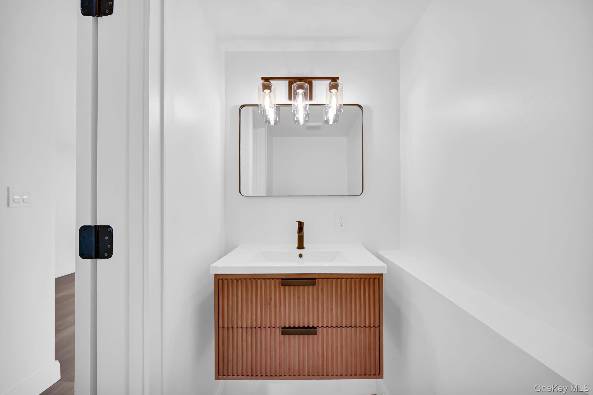 82 Seton Drive New Rochelle, NY 10804 - Photo 41 of 50 a bathroom with a sink and a mirror