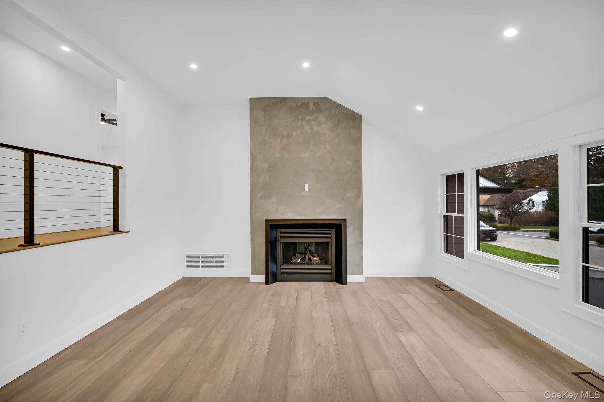 82 Seton Drive New Rochelle, NY 10804 - Photo 6 of 50 a view of an empty room with a window and fireplace