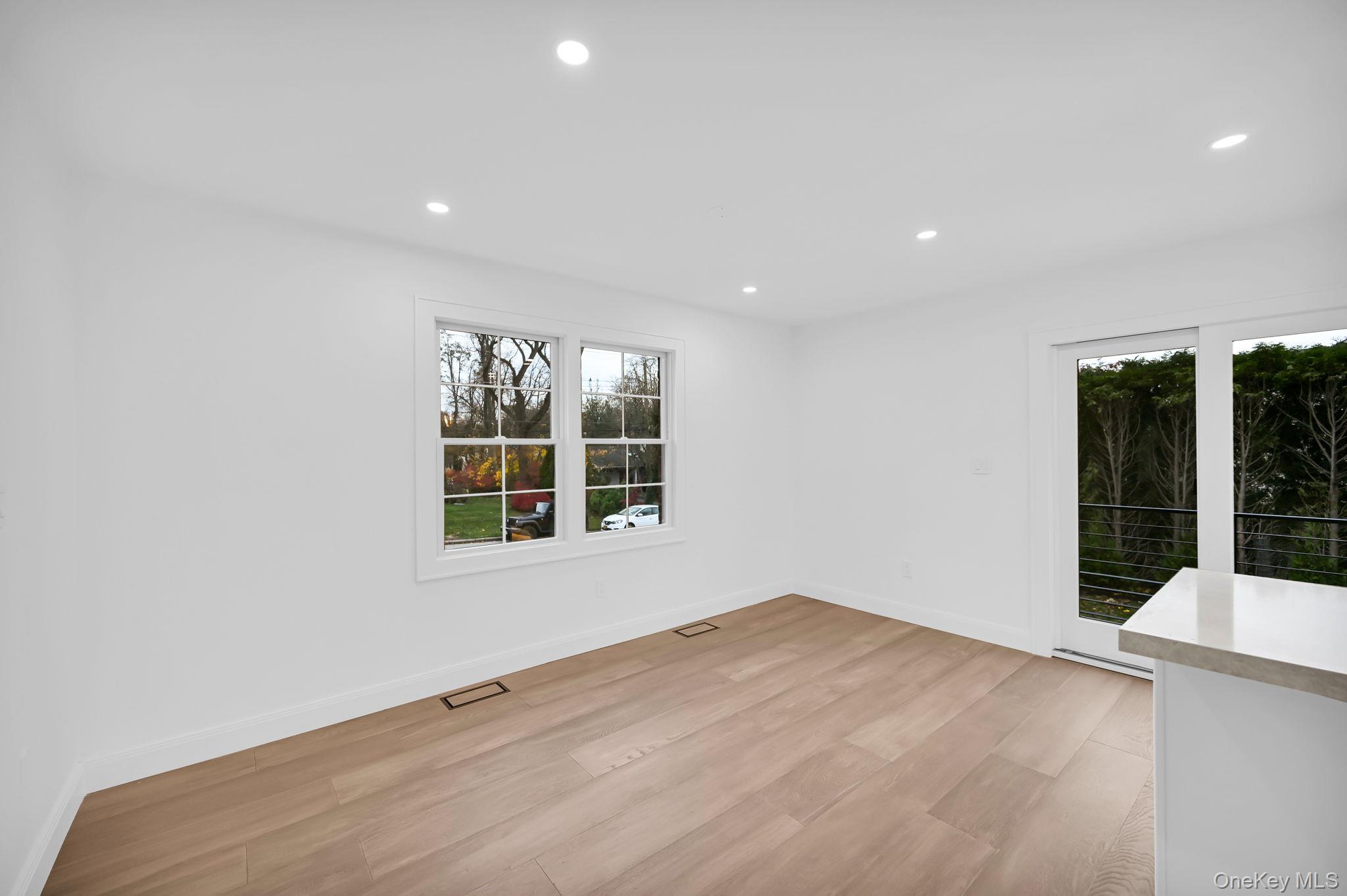 82 Seton Drive New Rochelle, NY 10804 - Photo 9 of 50 an empty room with windows