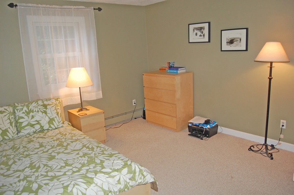 209 Great Road, Unit B5 Acton, MA 01720 - Photo 5 of 11 a bedroom with a bed and a lamp