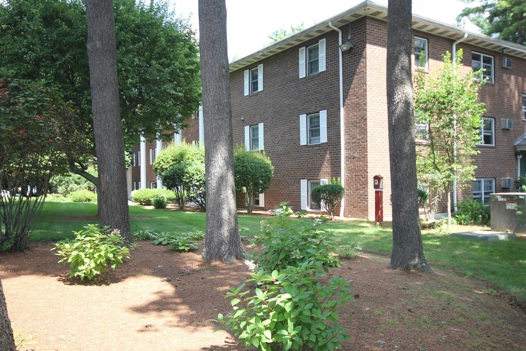 209 Great Road, Unit B5 Acton, MA 01720 - Photo 9 of 11 a front view of a house with garden