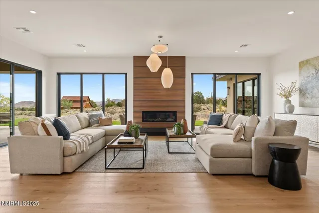 a living room with furniture and a fireplace