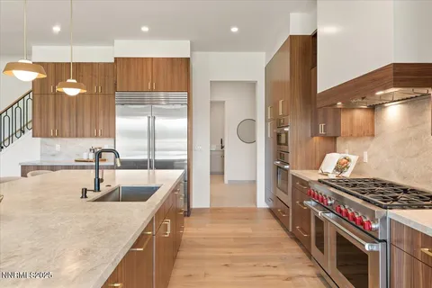 a kitchen with a sink cabinets and appliances