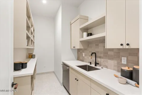 a bedroom with two large bed and a large window