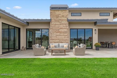 a bedroom with a large bed and a large window