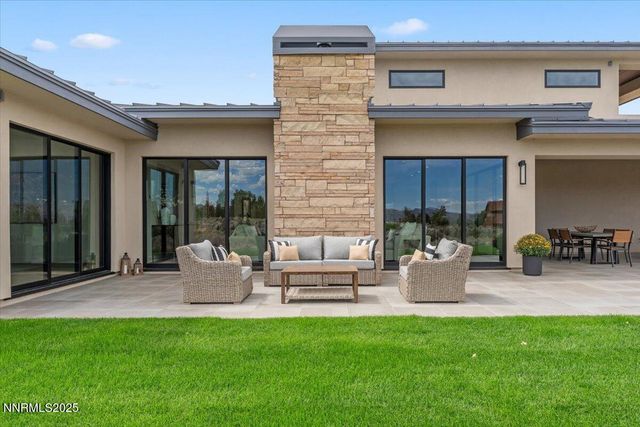 a bedroom with a large bed and a large window