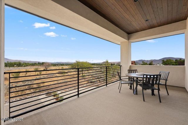 a view of a terrace with furniture and garden
