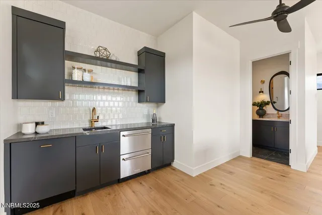 an aerial view of a house with a big yard