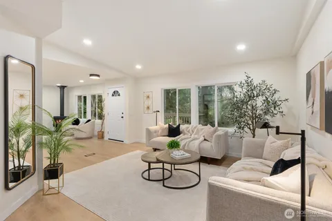 a living room with furniture and a table