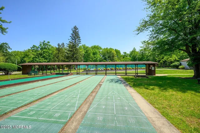 a view of swimming pool with a yard