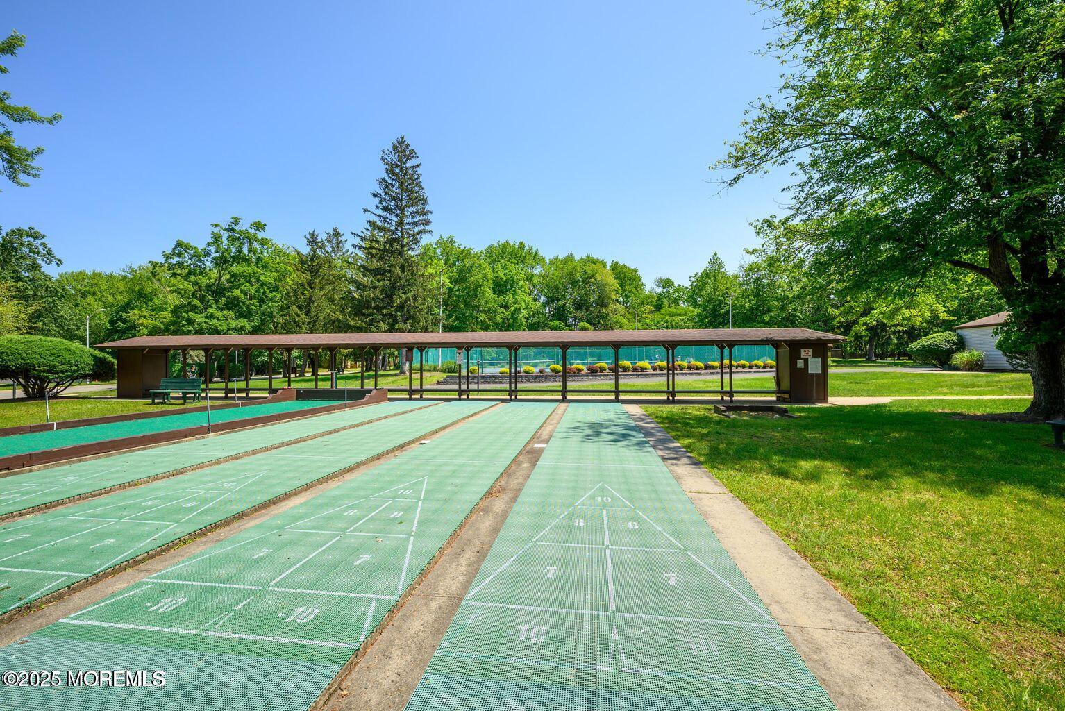 97 Arrowood Road, Unit K Manalapan, NJ 07726 - Photo 25 of 29 a view of swimming pool with a yard