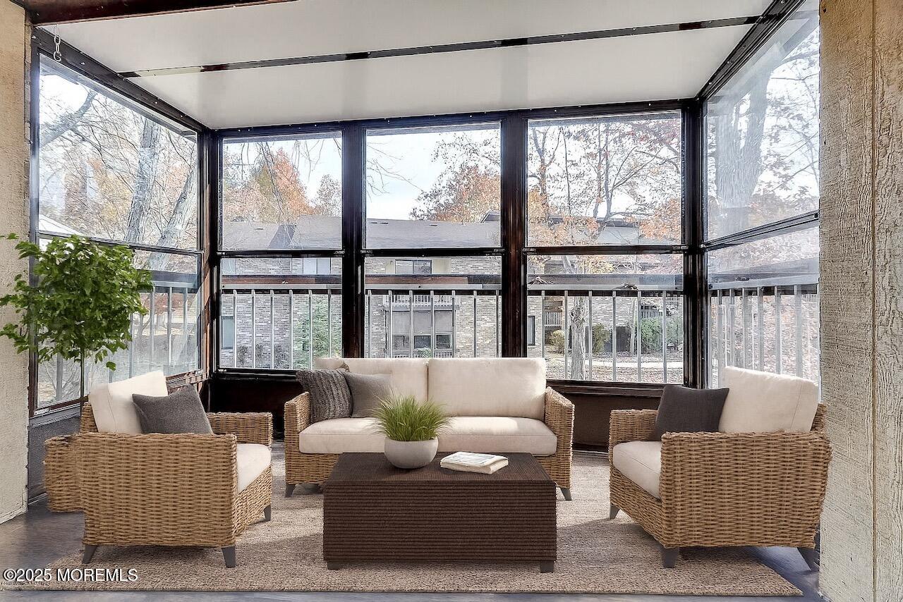 97 Arrowood Road, Unit K Manalapan, NJ 07726 - Photo 8 of 29 a living room with furniture and a large window