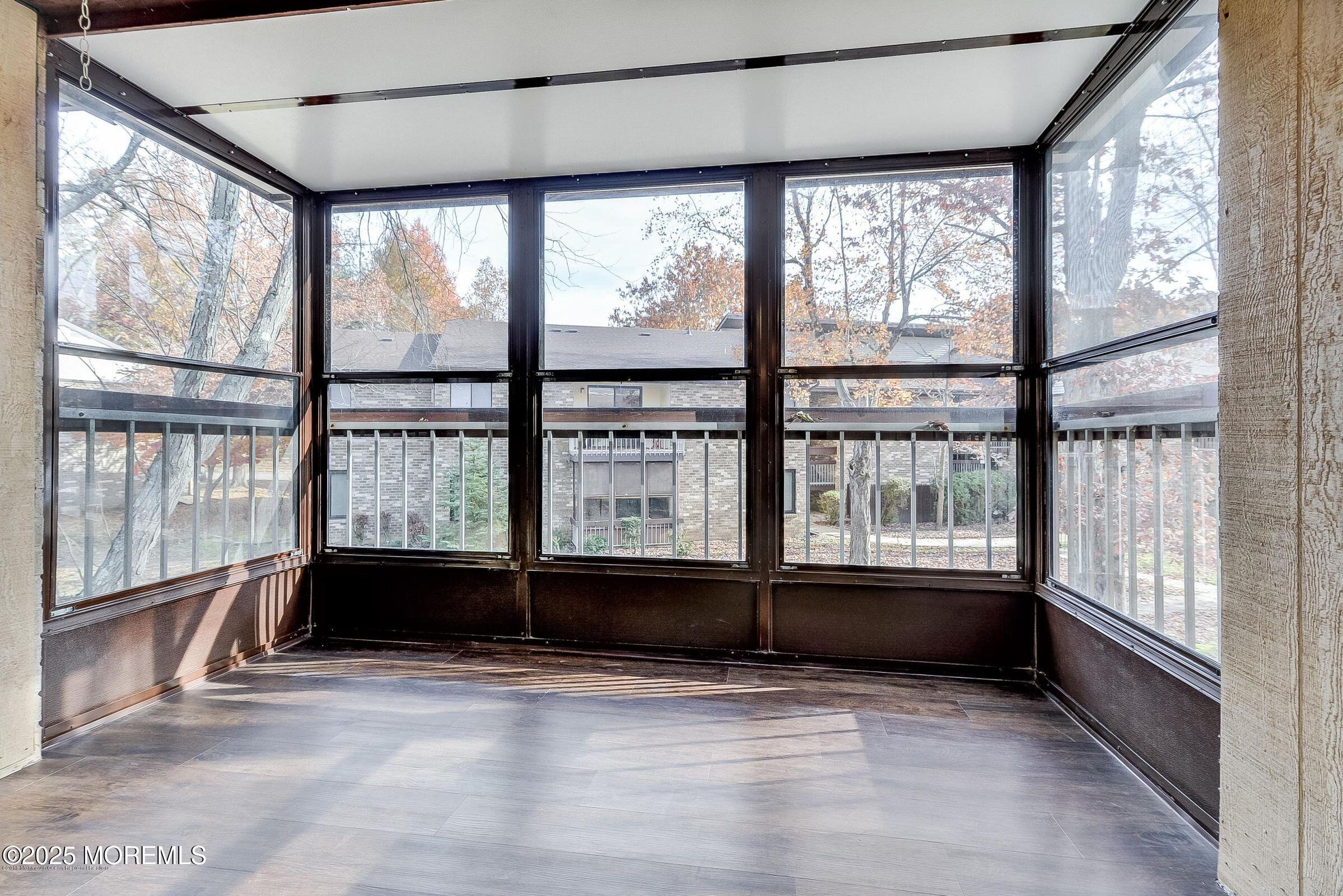 97 Arrowood Road, Unit K Manalapan, NJ 07726 - Photo 9 of 29 a view of an empty room with a window