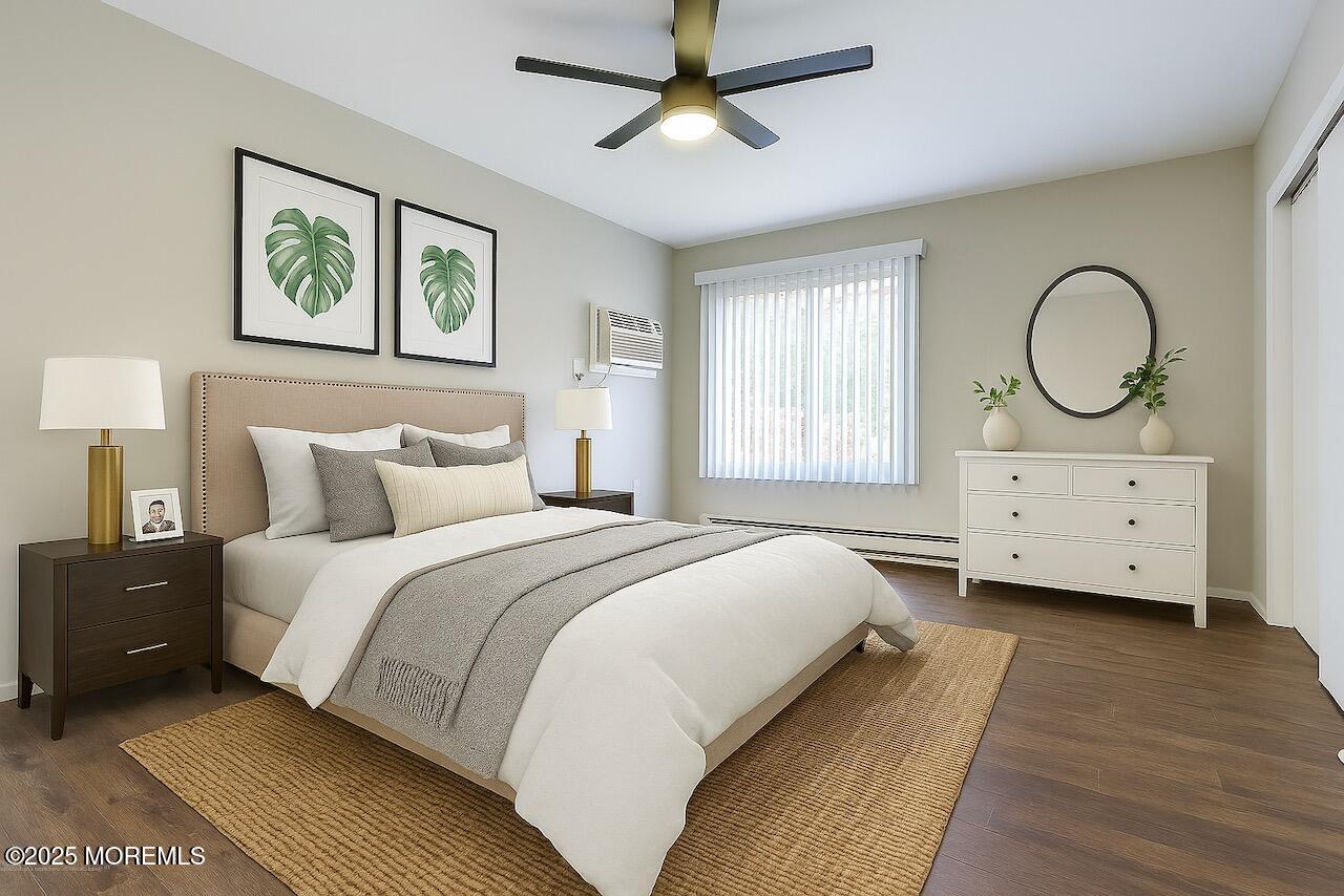 97 Arrowood Road, Unit K Manalapan, NJ 07726 - Photo 10 of 29 a bedroom with a bed a mirror and a window