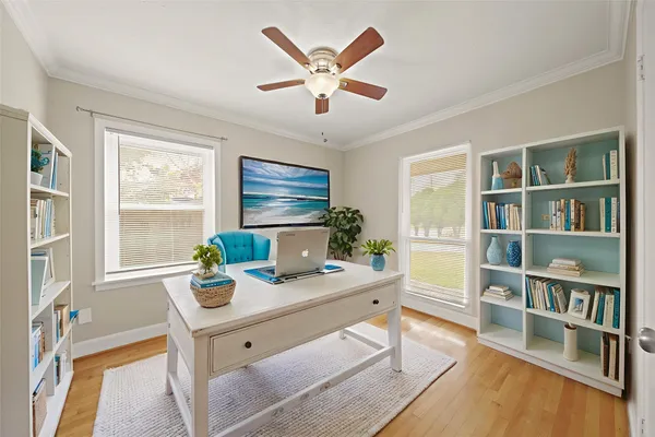 a workspace with furniture and a window