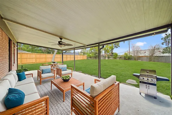 a outdoor living space with furniture and garden view