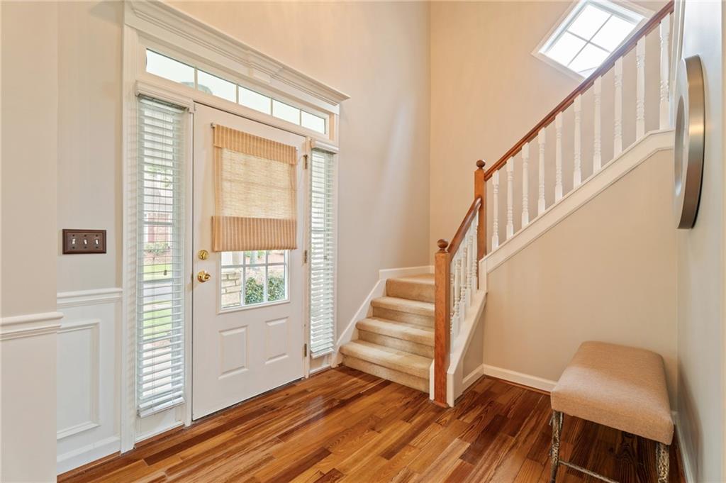 878 Scales Road Suwanee, GA 30024 - Photo 3 of 17 a view of an entryway with wooden floor and windows