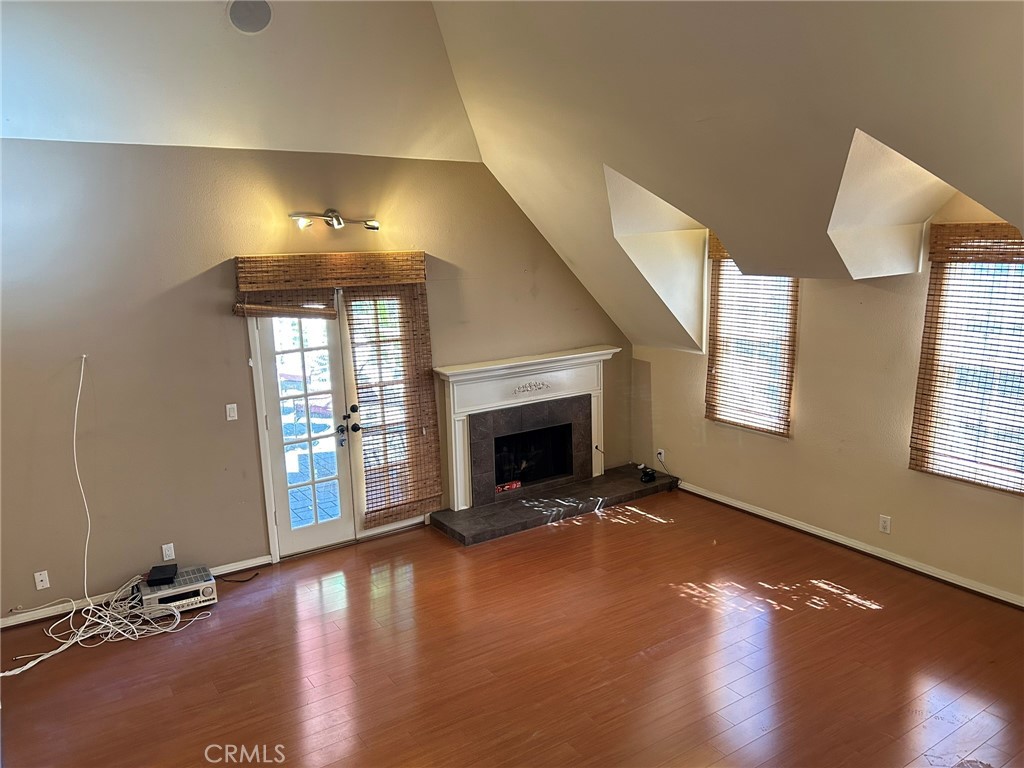 300 South Timken Road Anaheim, CA 92808 - Photo 25 of 40 an empty room with a fireplace and windows