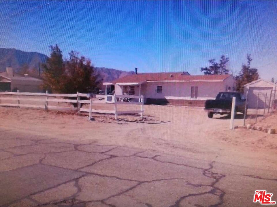 10316 Baker Road Lucerne Valley, CA 92356 - Photo 3 of 6 a view of a house with a yard and sitting area