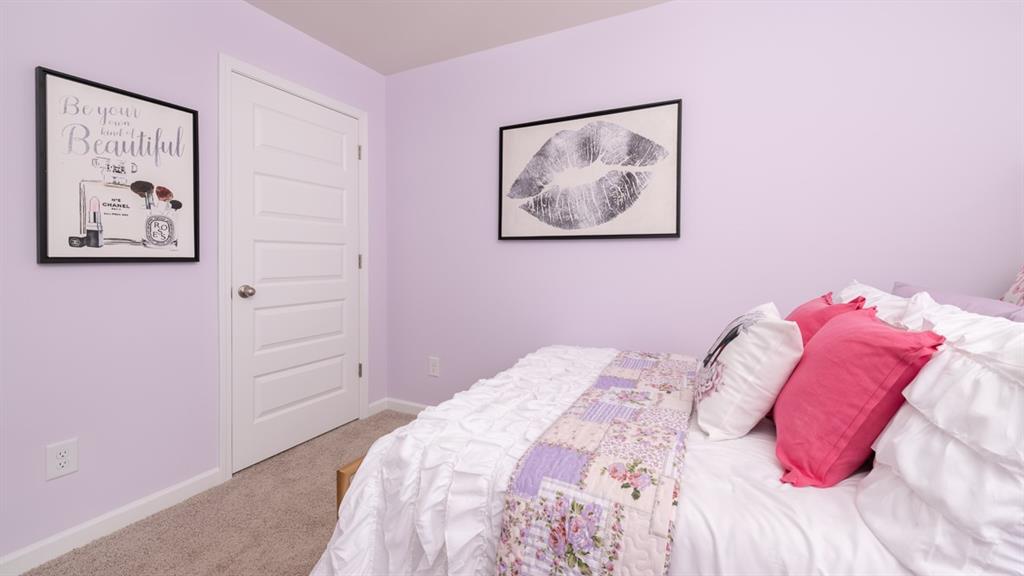 2086 Moss Hill Road Stone Mountain, GA 30083 - Photo 33 of 39 a bedroom with a bed and a painting on the wall