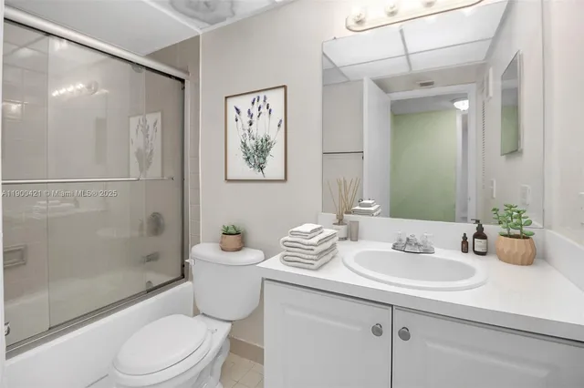 a kitchen with stainless steel appliances a sink and a refrigerator