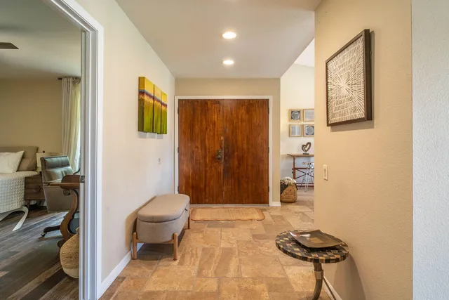 a bathroom with a shower a toilet and a sink